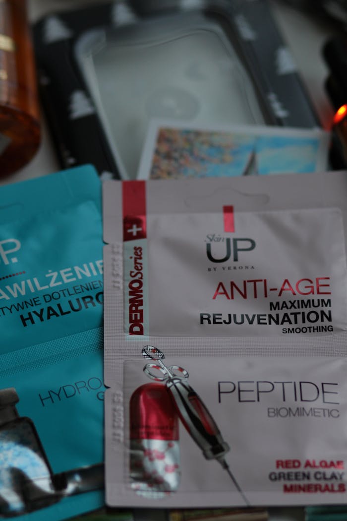 Detailed image of various skincare products featuring anti-age cream for rejuvenation and peptide bio mimetic formula.
